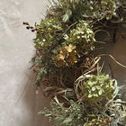 Samhain wreath detail with seasonal foliage and berries