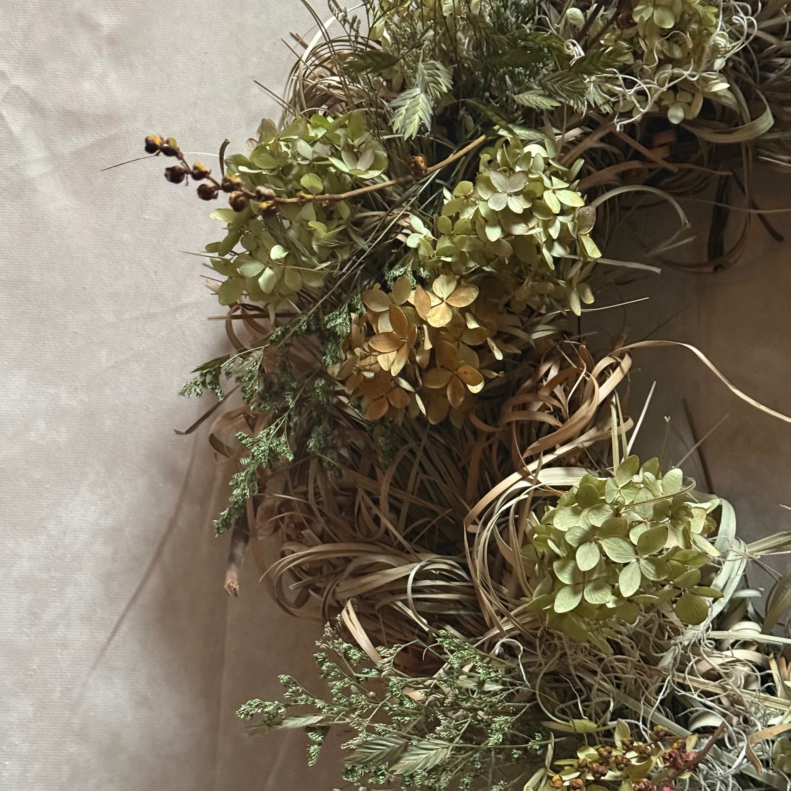 Samhain wreath detail with seasonal foliage and berries