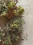 Samhain wreath styled on a rustic wooden door