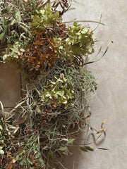 Samhain wreath styled on a rustic wooden door