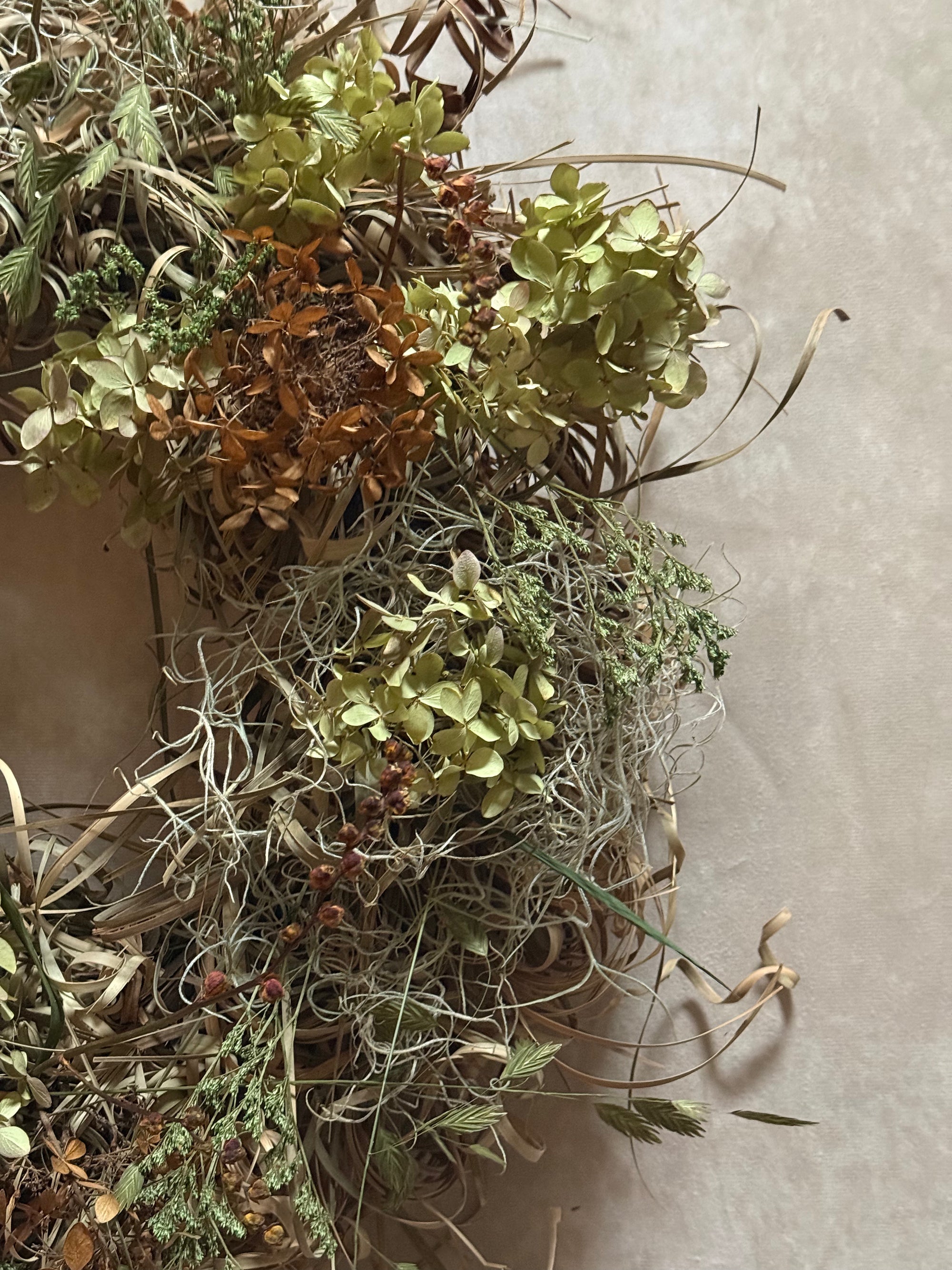Samhain wreath styled on a rustic wooden door