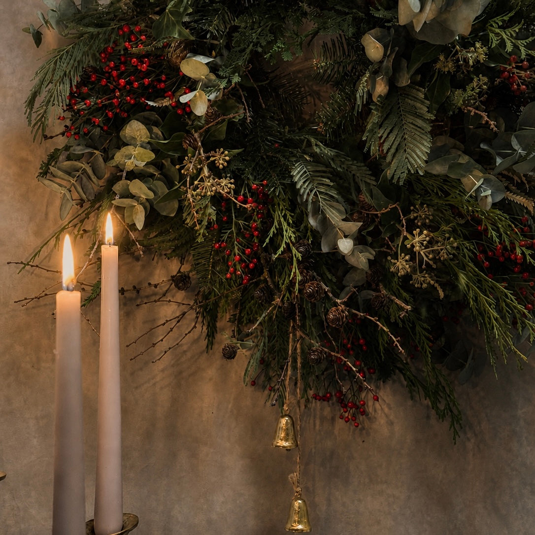 A natural Christmas wreath made with seasonal foliage at the Myrtle & Bracken workshop